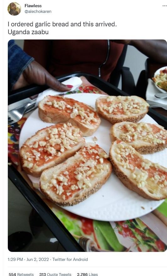 Flawless alecnokaren ordered garlic bread and this arrived . uganda zaabu 1.29 p
