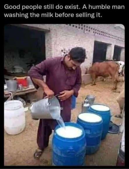 Good people still do exist. A humble man washing the milk before selling it.