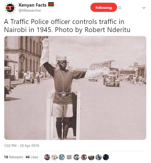Kenyan facts kresearcher following a traffic police officer controls traffic in
