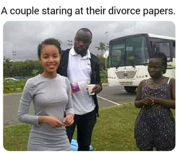 A couple staring at their divorce papers.