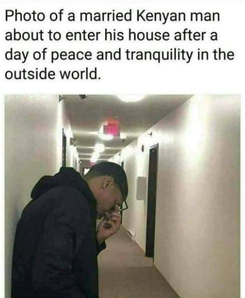 Photo of a married kenyan man about to enter his house after a day of peace and