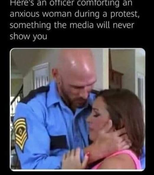Here an orticer comtorting an anxious woman during a protest, something the medi